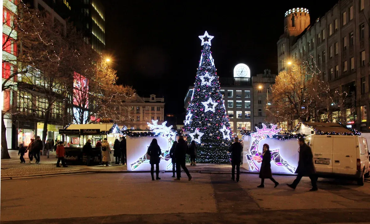 Christmas tree and market lights on Wenceslas Square with the National Museum behind